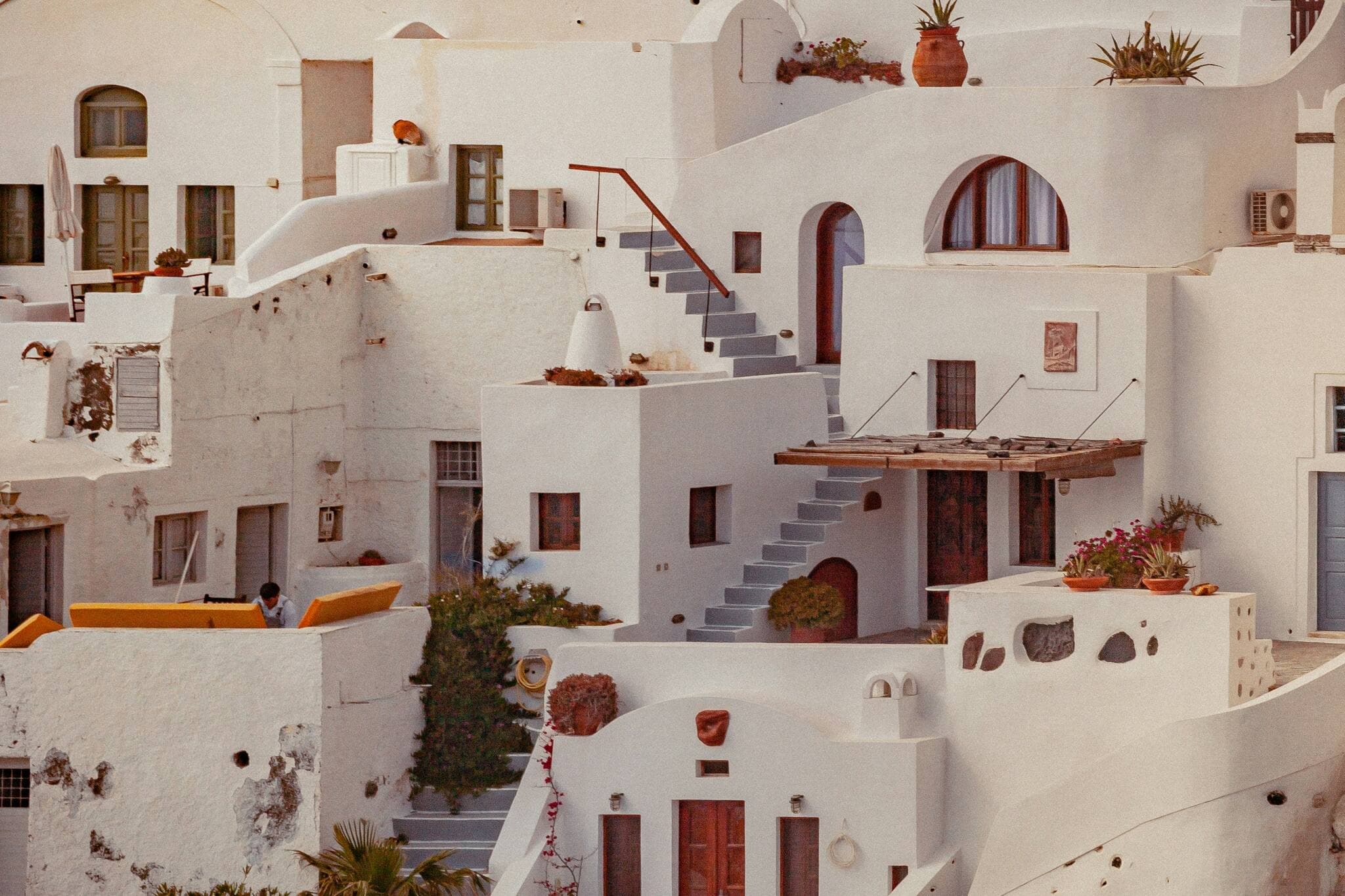 Whitewashed buildings and stairways stacked on a hillside